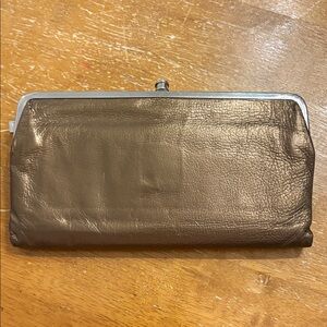 Hobo wallet metallic gold small tear (see photo)